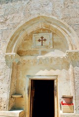 Fototapeta na wymiar The entrance of the Church of Kish dated back to 5th Century. Kisi Sheki (Shaki) Azerbaijan.