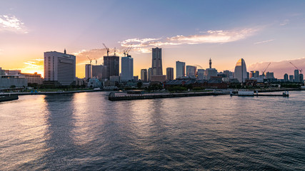 Fototapeta na wymiar Colorful sunset over the buildings at the Yokohama Ferry Terminal.