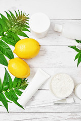 Natural organic homemade cosmetics with lemon. Skin care. Spa salon and treatments. Beautician background. Clay, lemon, beauty products.Tropical summer concept. Flat lay, copy space