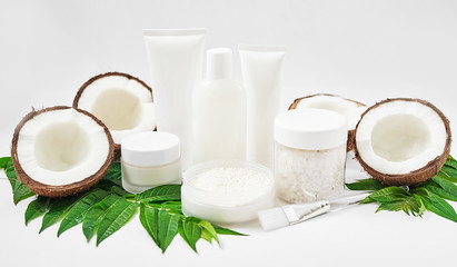 Natural organic homemade cosmetics with coconut. Skin care. Spa salon and treatments. Beautician background. Clay, lemon, beauty products.Tropical summer concept. Flat lay, copy space. Coconut milk
