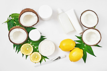 Natural organic homemade cosmetics with lemon and coconut. Skin care. Spa salon and treatments. Beautician background. Clay, lemon, beauty products.Tropical summer concept. Flat lay, copy space