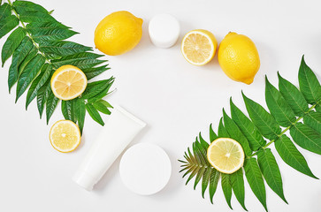 Natural organic homemade cosmetics with lemon. Skin care. Spa salon and treatments. Beautician background. Clay, lemon, beauty products.Tropical summer concept. Flat lay, copy space