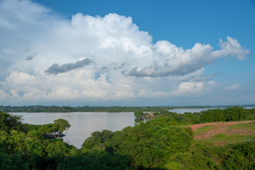 Country landscape of lagoon between lush trees in Colombia