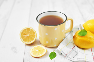 Fototapeta na wymiar Tea with lemon. Cup of tea. Cozy morning. Healthy breakfast. Good morning. Health prevention. Vitamins. Citruses for colds, copy space. Aromatherapy. Food mood. Food and drink, still life health care