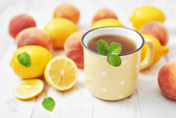 Fruit lemons and peaches on white background. Summer postcard. Hello summer! Harvesting. Healthy food and nutrition. Fruit background. Healthy cozy breakfast. Natural organic products. Vitamins