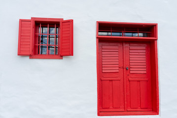 Colorful red pink door desing on white wall