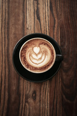 A cup of coffee with latte art on top