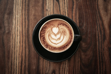 A cup of coffee with latte art on top