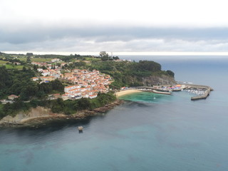 Fototapeta premium Beautiful beach in Lastres. Asturias. Colunga, Spain. Aerial Drone Photo
