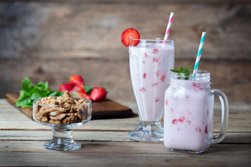 strawberry yogurt in glasses on wooden background
