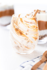 Yogurt with chia, peanut cream and nuts jars.