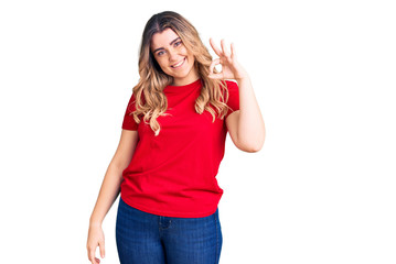 Young caucasian woman wearing casual clothes smiling positive doing ok sign with hand and fingers. successful expression.