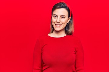 Obraz premium Young beautiful woman wearing casual clothes with a happy and cool smile on face. lucky person.