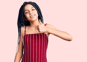 Cute african american girl wearing casual clothes smiling happy and positive, thumb up doing excellent and approval sign