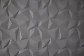 Abstract background of polygons on grey background.