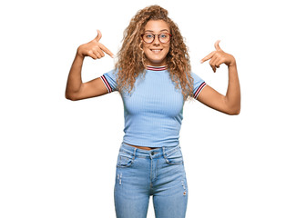 Beautiful caucasian teenager girl wearing casual clothes and glasses looking confident with smile on face, pointing oneself with fingers proud and happy.