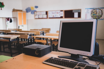empty classroom and desktop computer