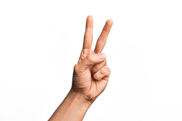 Hand of caucasian young man showing fingers over isolated white background counting number 2 showing two fingers, gesturing victory and winner symbol