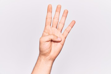 Close up of hand of young caucasian man over isolated background counting number 4 showing four fingers - obrazy, fototapety, plakaty