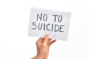 Cardboard banner with NO TO SUICIDE text over isolated white background