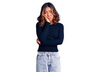Young beautiful mixed race woman wearing casual clothes thinking looking tired and bored with depression problems with crossed arms.
