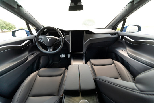 The interior of a full-sized, all-electric, luxury, crossover SUV Tesla Model X. Black and grey.