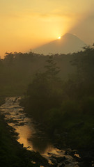 Sunrise on Mount Merbabu with the Pabelan river foreground