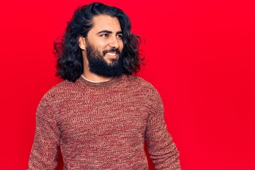 Fototapeta na wymiar Young arab man wearing casual clothes looking to side, relax profile pose with natural face and confident smile.