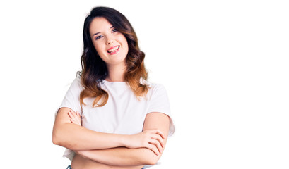 Obraz premium Beautiful young brunette woman wearing casual clothes happy face smiling with crossed arms looking at the camera. positive person.