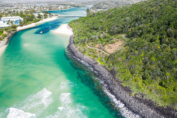 Burleigh Heads National Park aerial image with Tallebudgera creek and sand pumping/dredging boat