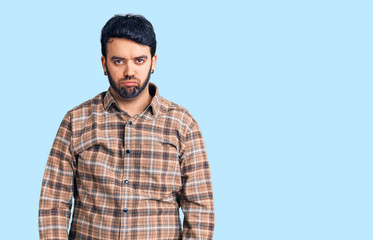 Young hispanic man wearing casual clothes depressed and worry for distress, crying angry and afraid. sad expression.