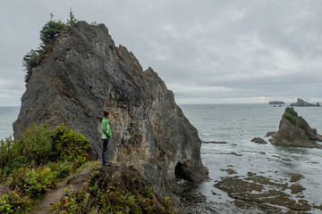 Woman Looks Out Over Rocky Washington Coast