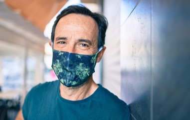 Middle age man with beard wearing coronavirus safety mask