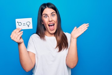 Beautiful woman asking for sex discrimination holding paper with gender equality concept...