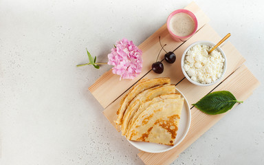 Delicious pancakes on a plate with coffee and berries. Breakfast, dessert, recipe, French cuisine. Copy space. 