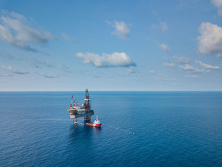 Aerial view from a drone of an offshore jack up rig at the offshore location during day time