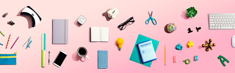 Collection of electronic gadgets and office supplies - flat lay