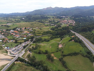 Fototapeta na wymiar Road in landscape of Colunga, Asturias,Spain. Aerial Drone Photo