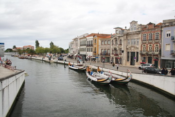 Traditional boats, Colorful Moliceiro boat, on the canal in Aveiro, Portugal.