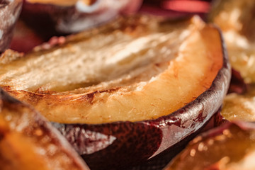 One sliced in half semi dried plum fruit - macro shot