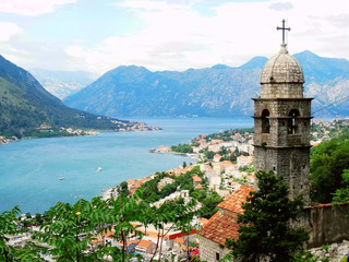 Naklejka na ściany i meble Aerial view of Kotor bay and old city in Kotor, Montenegro. Kotor is a coastal town in a secluded Gulf of Kotor, its preserved medieval old town is an UNESCO World Heritage Site. 