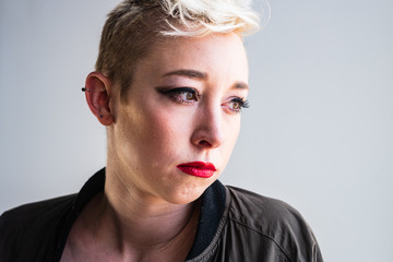 Portrait of a young, urban, androgynous woman.