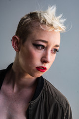 Portrait of a young, urban, androgynous woman.