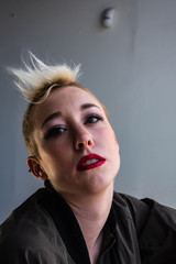 Portrait of a young, urban, androgynous woman.