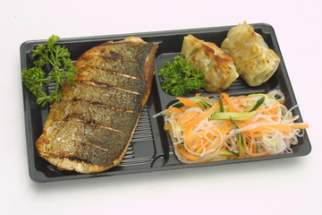grilled salmon an sushi with vegetables