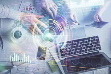Double exposure of man and woman working together and data theme hologram drawing. Computer background. Top View.