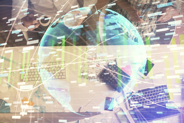 Double exposure of man and woman working together and business theme hologram drawing. Computer background. Top View.