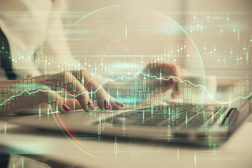 Multi exposure of woman hands typing on computer and financial graph hologram drawing. Stock market analysis concept.