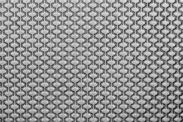 Close up shot of pattern on sheet metal
