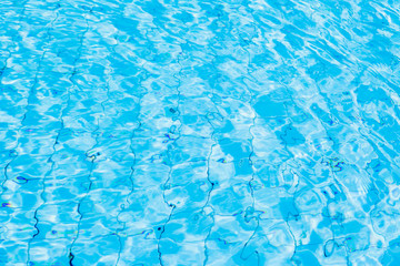 Blue ripe water reflection in swimming pool